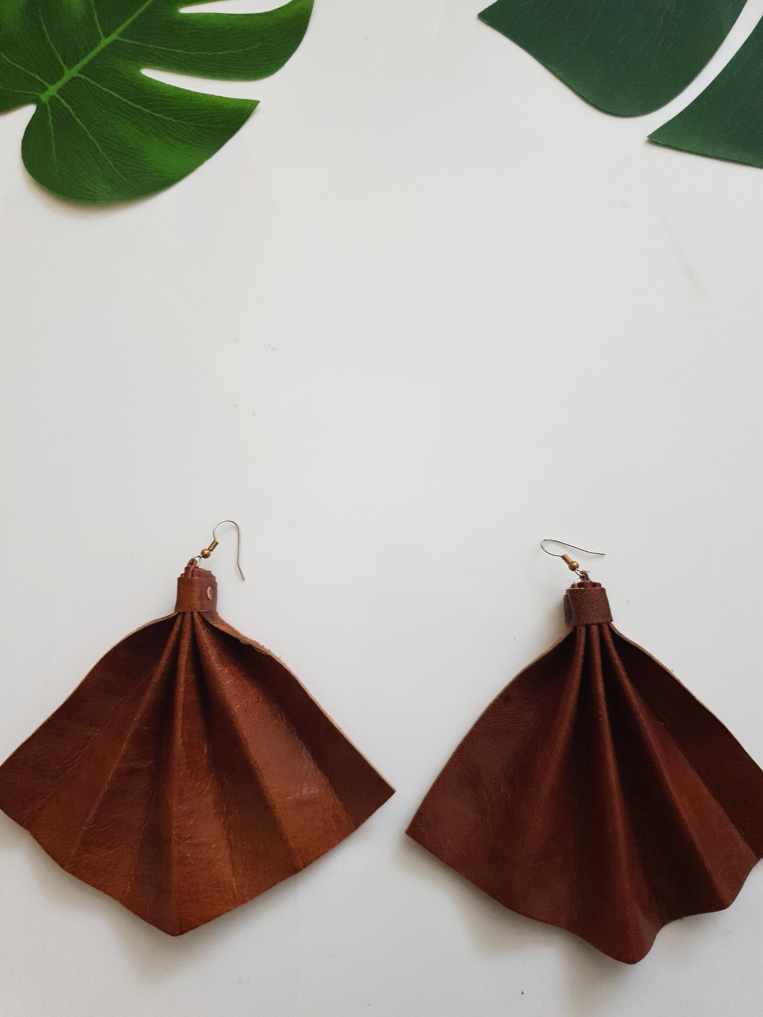 Leather on sale statement earrings